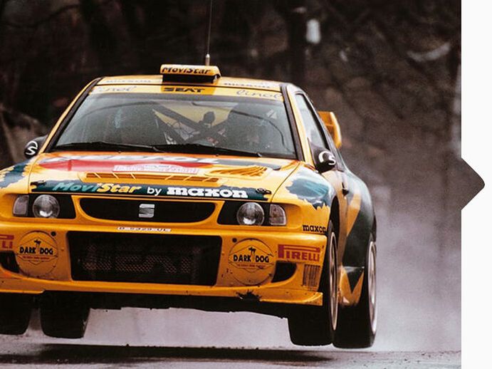 EIn gelber SEAT Cordoba WRC bei der Rallye Weltmeisterschaft 1998.